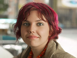 A photo of a woman with red hair.