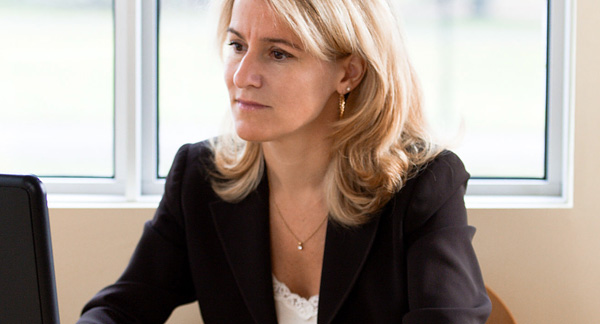 A photo of a woman conducting a job interview.