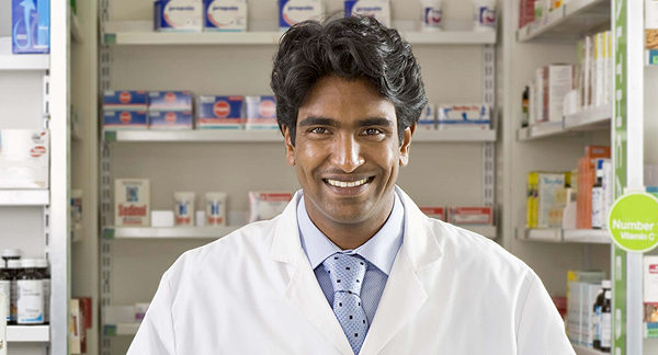 A photo of a pharmacist in a pharmacy.