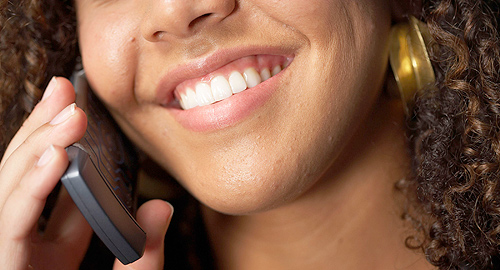 A photo of a woman speaking on a mobile phone.