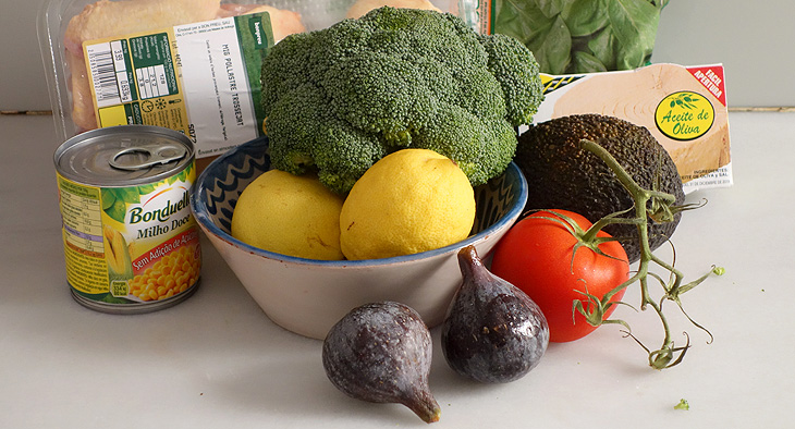 A photo of fresh food; chicken, fruit, vegetables and cans of tuna and sweetcorn. 