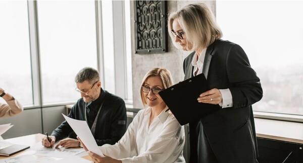 People discussing something in a business meeting.