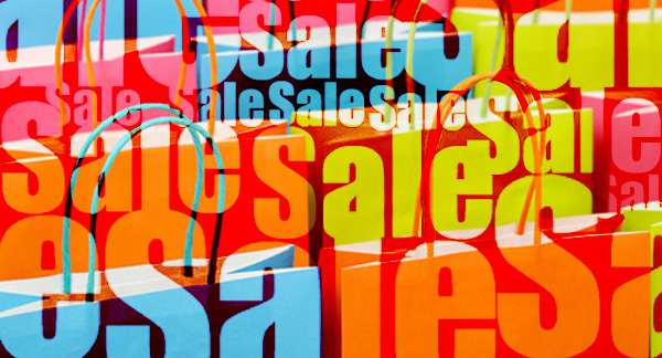 An illustration of brightly coloured shopping bags and the word Sales repeated many times.